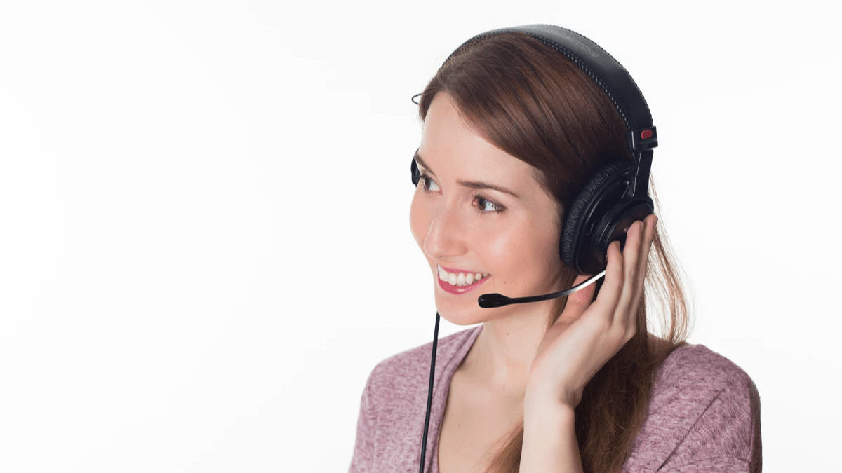 Customer support professional wearing a headset while answering an inquiry