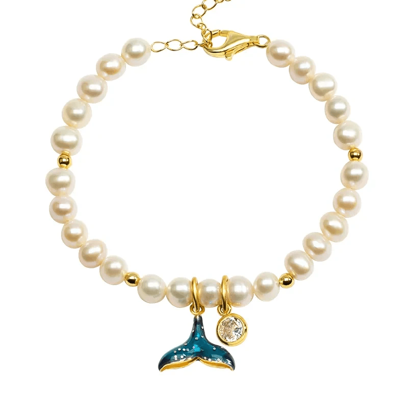 Stylish fish bracelet featuring gold and silver options.