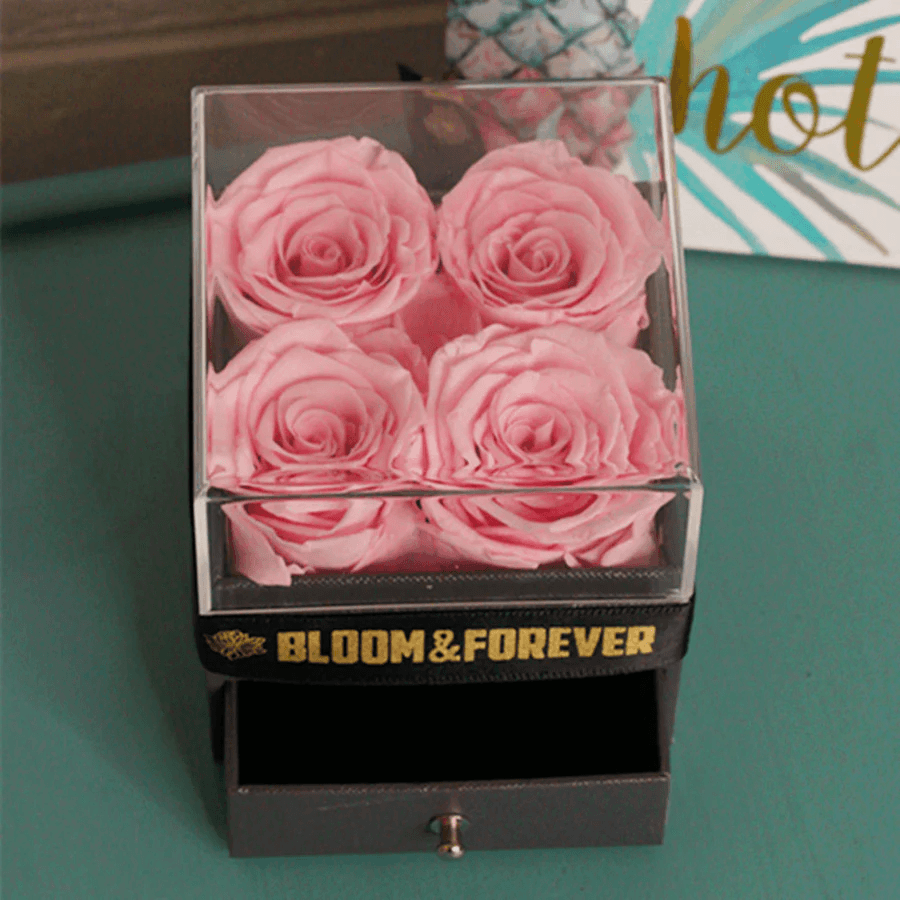 Beautiful display of an eternal flower arrangement featuring forever roses.