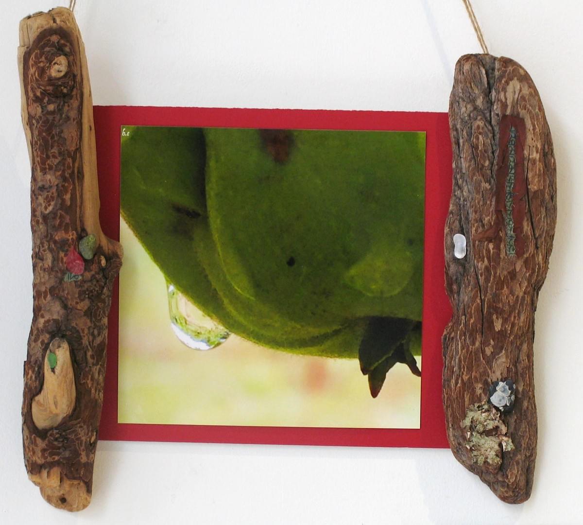 This photo was taken in a friend’s garden on the outskirts of Zürich, Switzerland the summer of 2015. Early morning dew drops, like jewels in the sun, highlighted all, including this juicy apple still ripening on its tree. The wood pieces that make up the frame, along with the beach glass and stones we're gathered in Saanich, BC. The lichen and arbutus bark were harvested in the Carmannah Wilderness while the prayer flags were found floating on the wind at the Buddhist retreat center on Mount Tuam, Salt Spring Island.