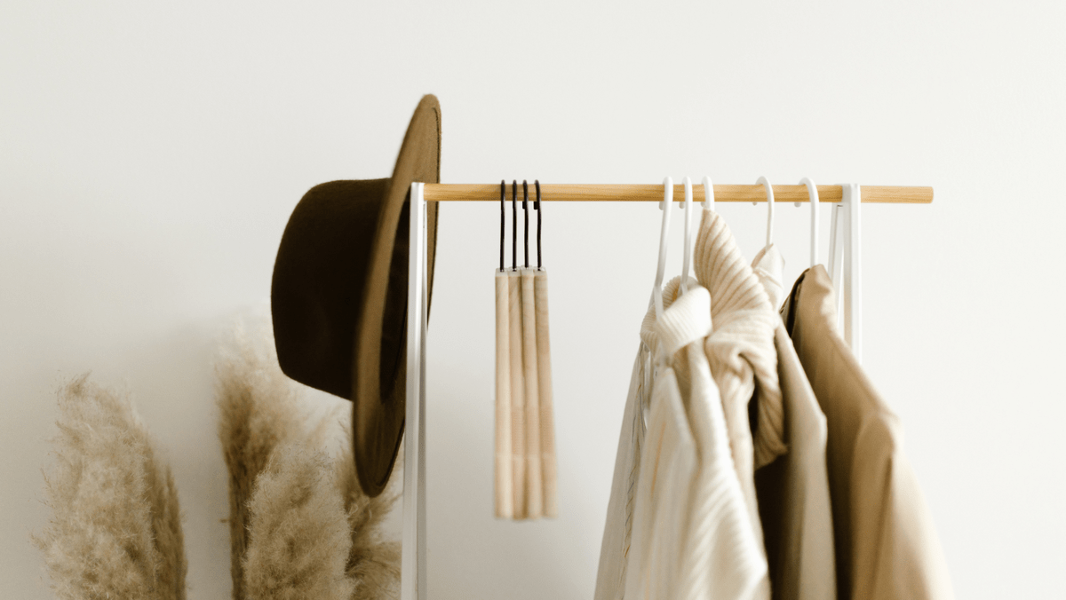 Clothes and Hats Hanging on a Rack