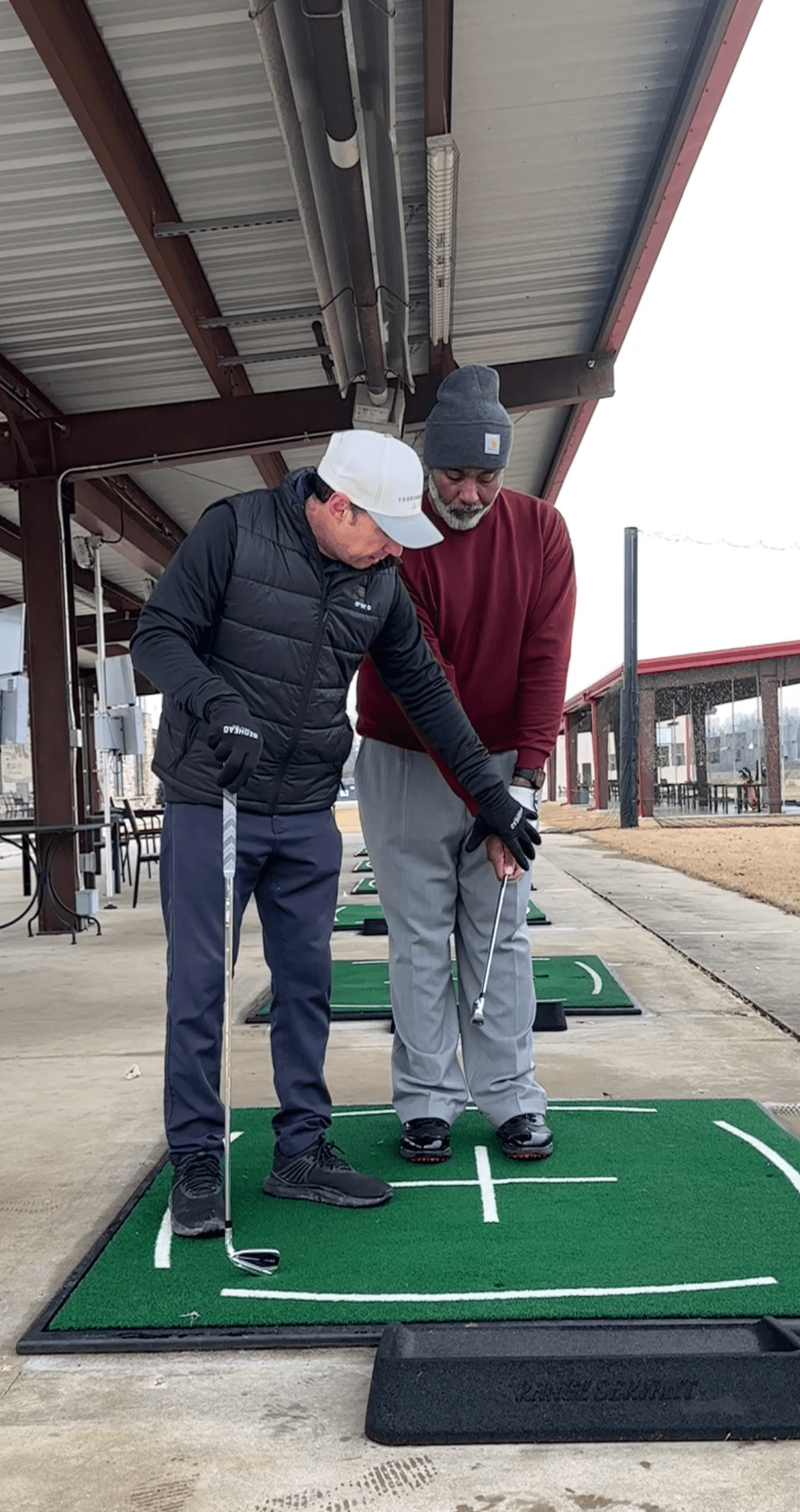 Mark Rippy teaching Rachon Johnson the "Shaft Awareness Drill" at Vantage Point Golf Center.