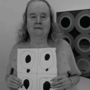 Artist Susan Woods displaying art.