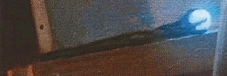 The glowing wand imagery of the Triple Goddess Tarot- page of wands