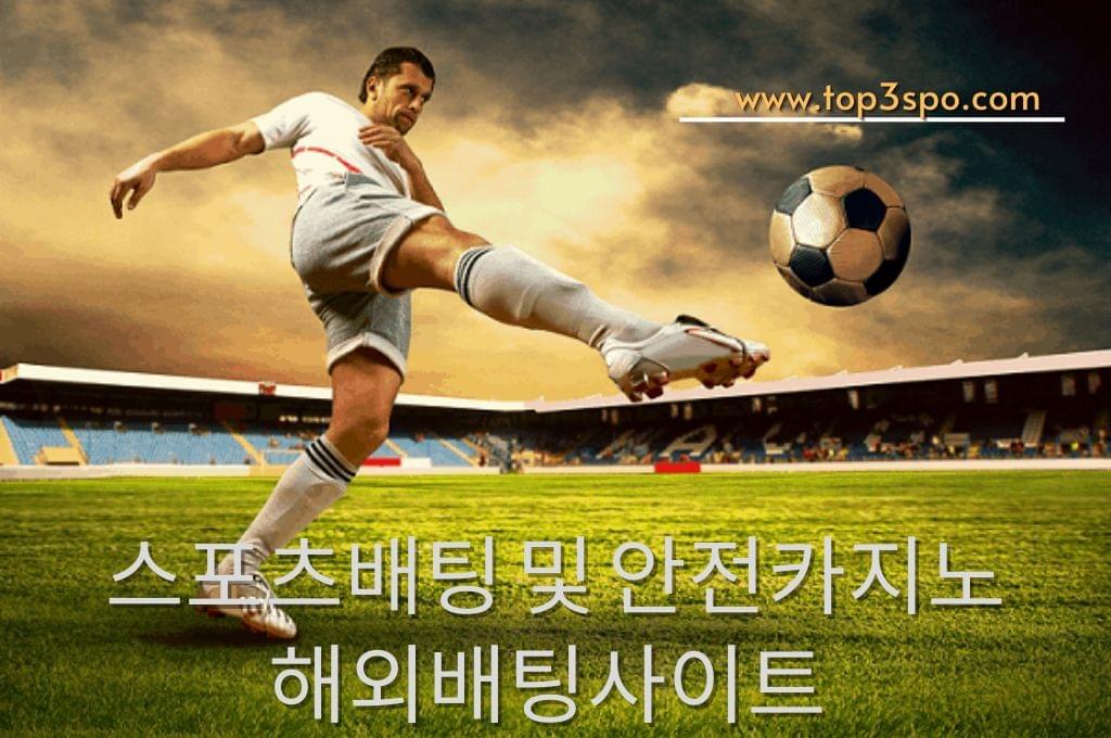 A Football player full force kick the ball.