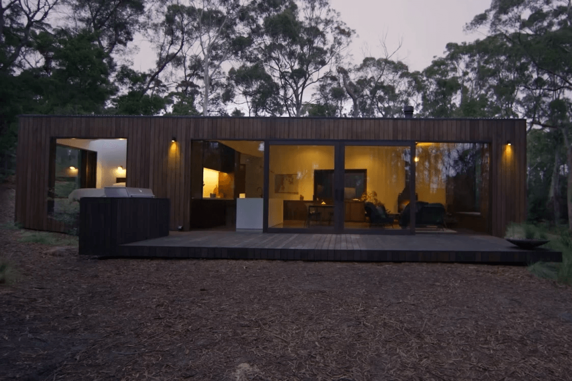 Innovative container home construction showcasing eco-friendly landscaping