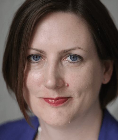 Lucy Watt, a counsellor, who is a white woman with blue eyes and light brown hair