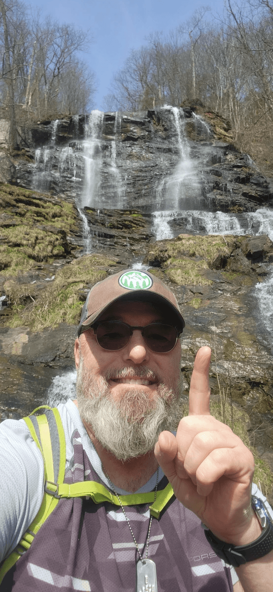 Ironheart John pointing to top of Amicalola Falls AT Approach Trail Dawsonville GA IronHike