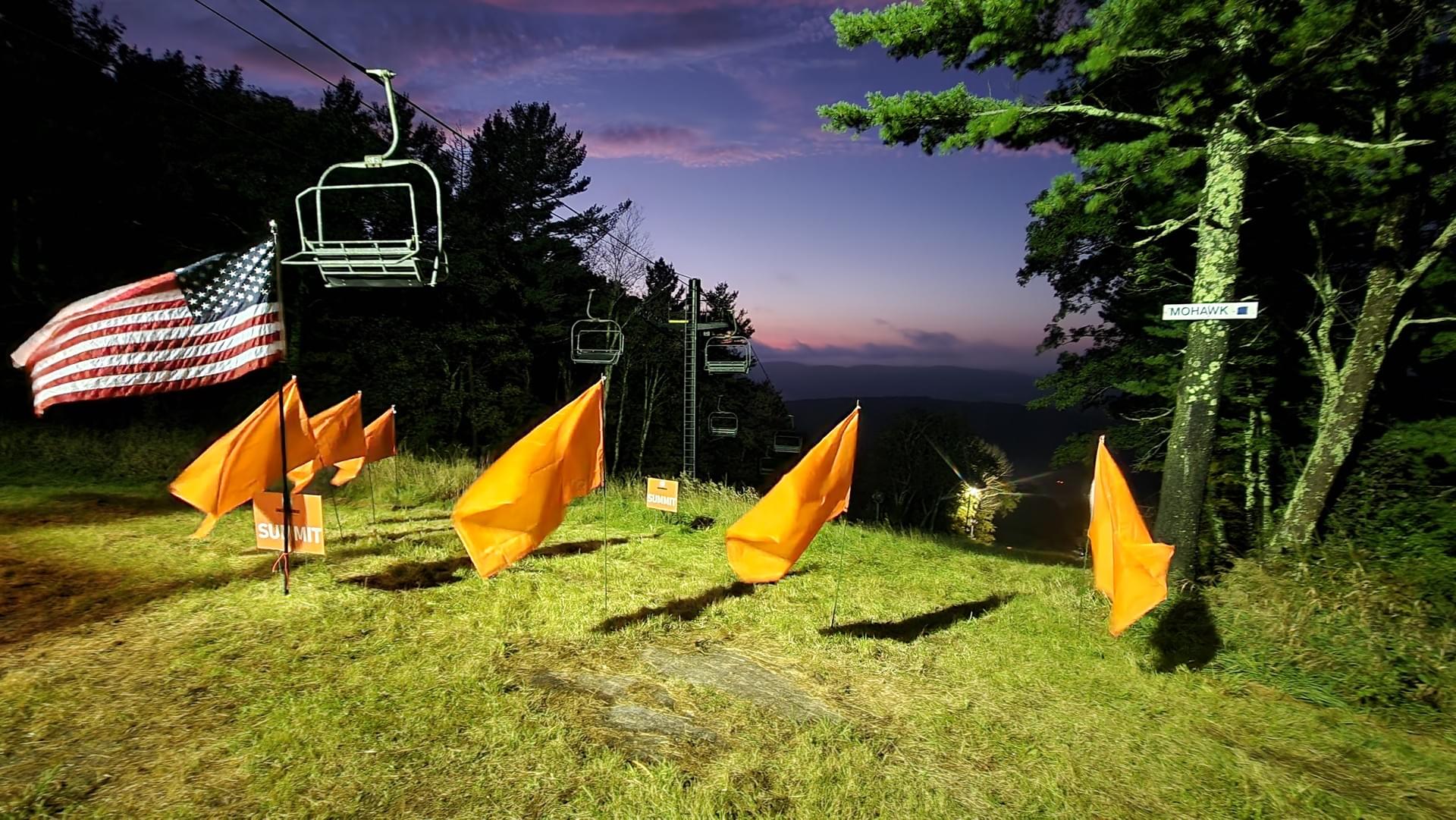 Summit flags and the American flag at dusk on Mohawk Mountain, Cornwall CT
