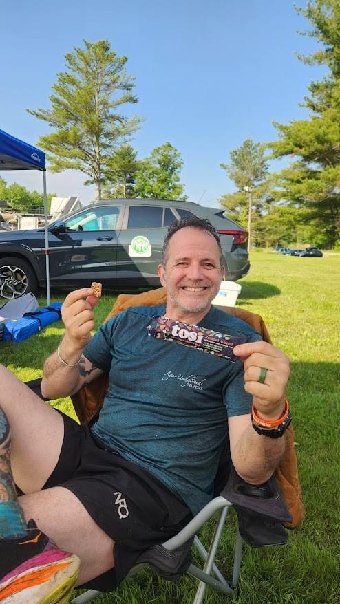 IronHike Mountain Athlete enjoying Tosi Snacks during elevation endurance Event Mohawk Mountain
