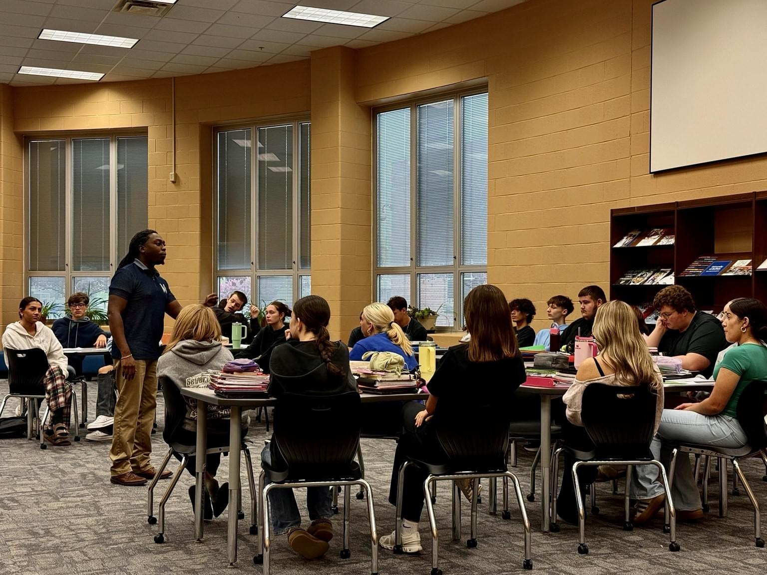 Maurice F. Martin facilitating an engaging school assembly for students