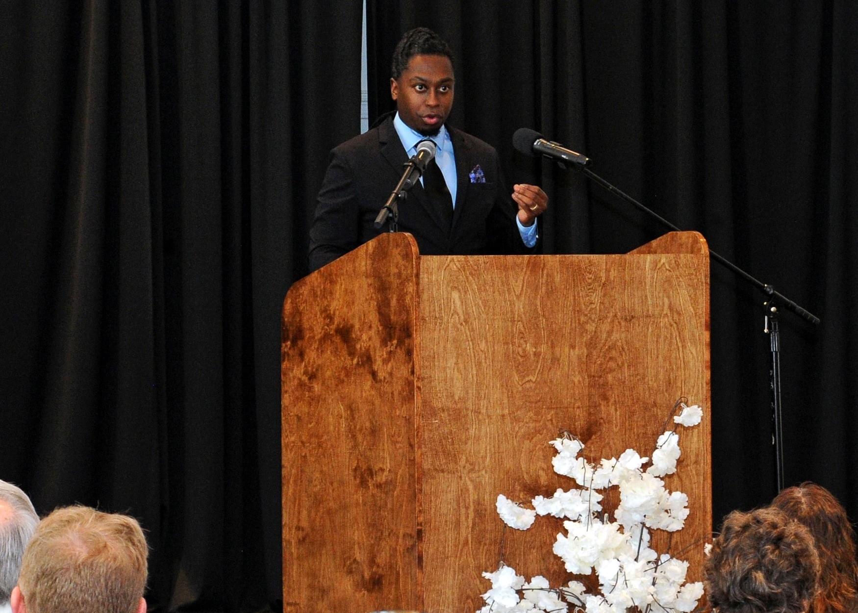 Maurice F. Martin delivering a leadership keynote on stage at an Ohio event