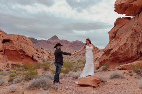 Las Vegas elopement photo of couple in wedding attire posing at Valley of Fire