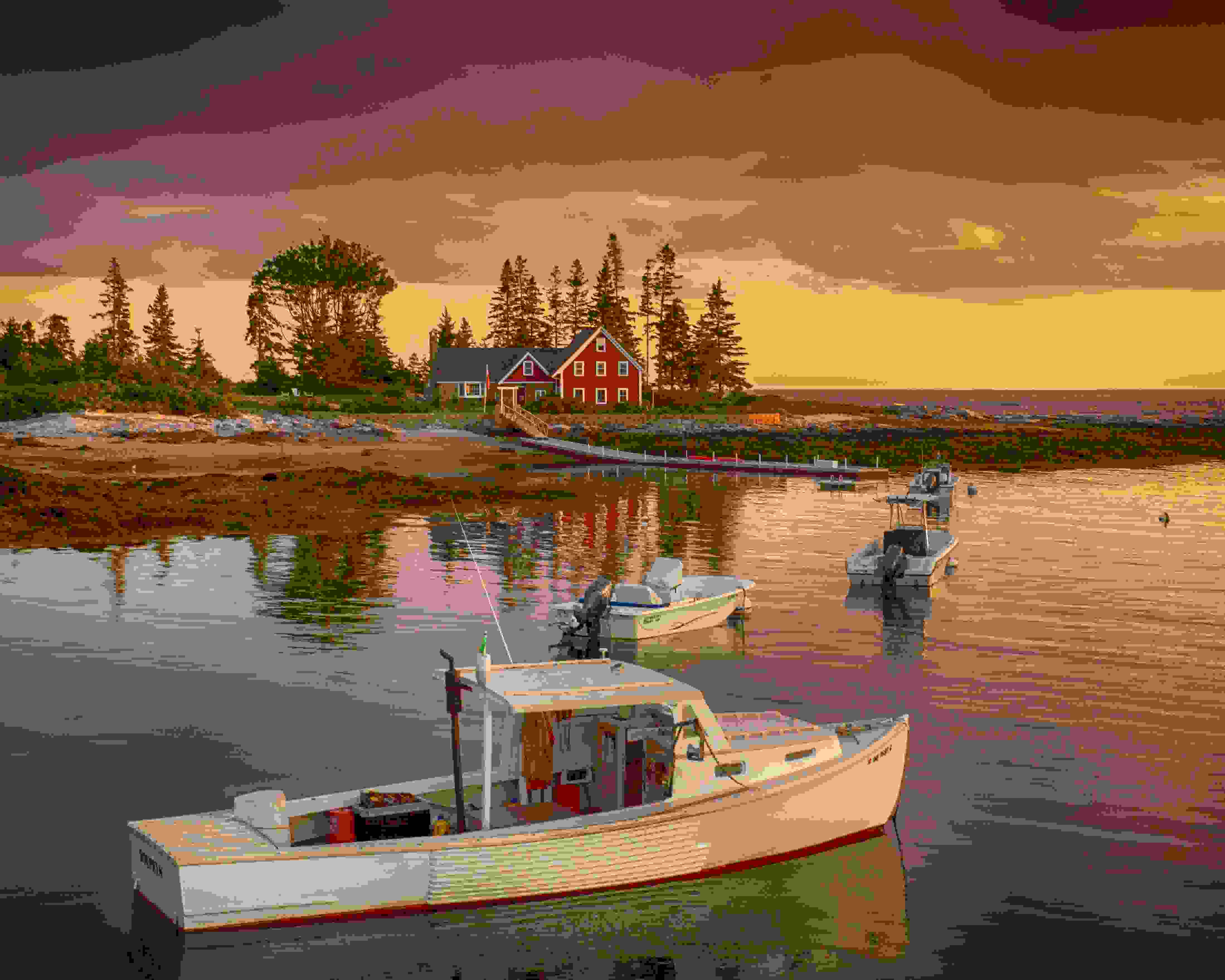 Small catamaran fishing boats ready for adventure at sunset
