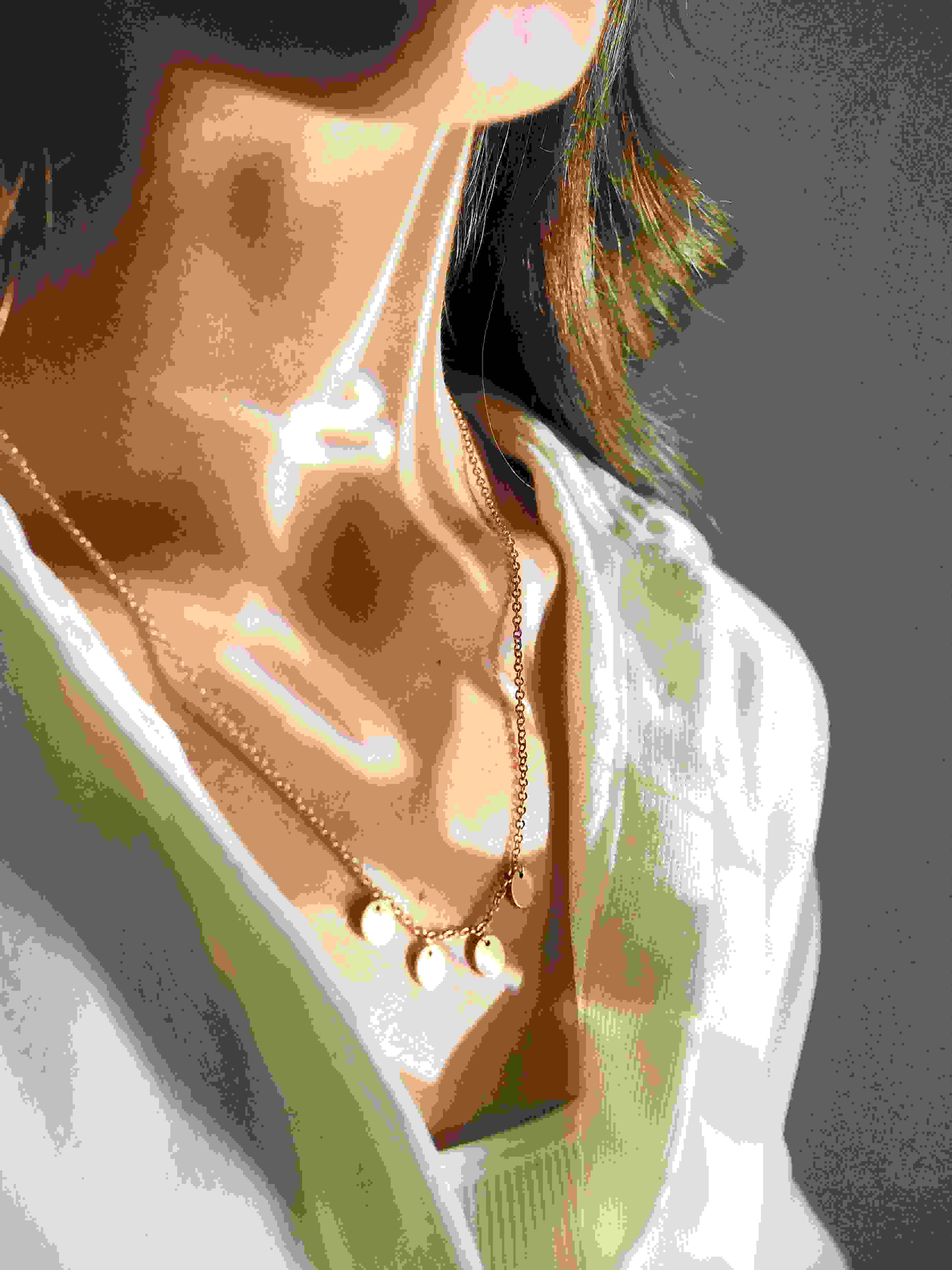 Beautiful woman wearing stylish necklaces for sister.