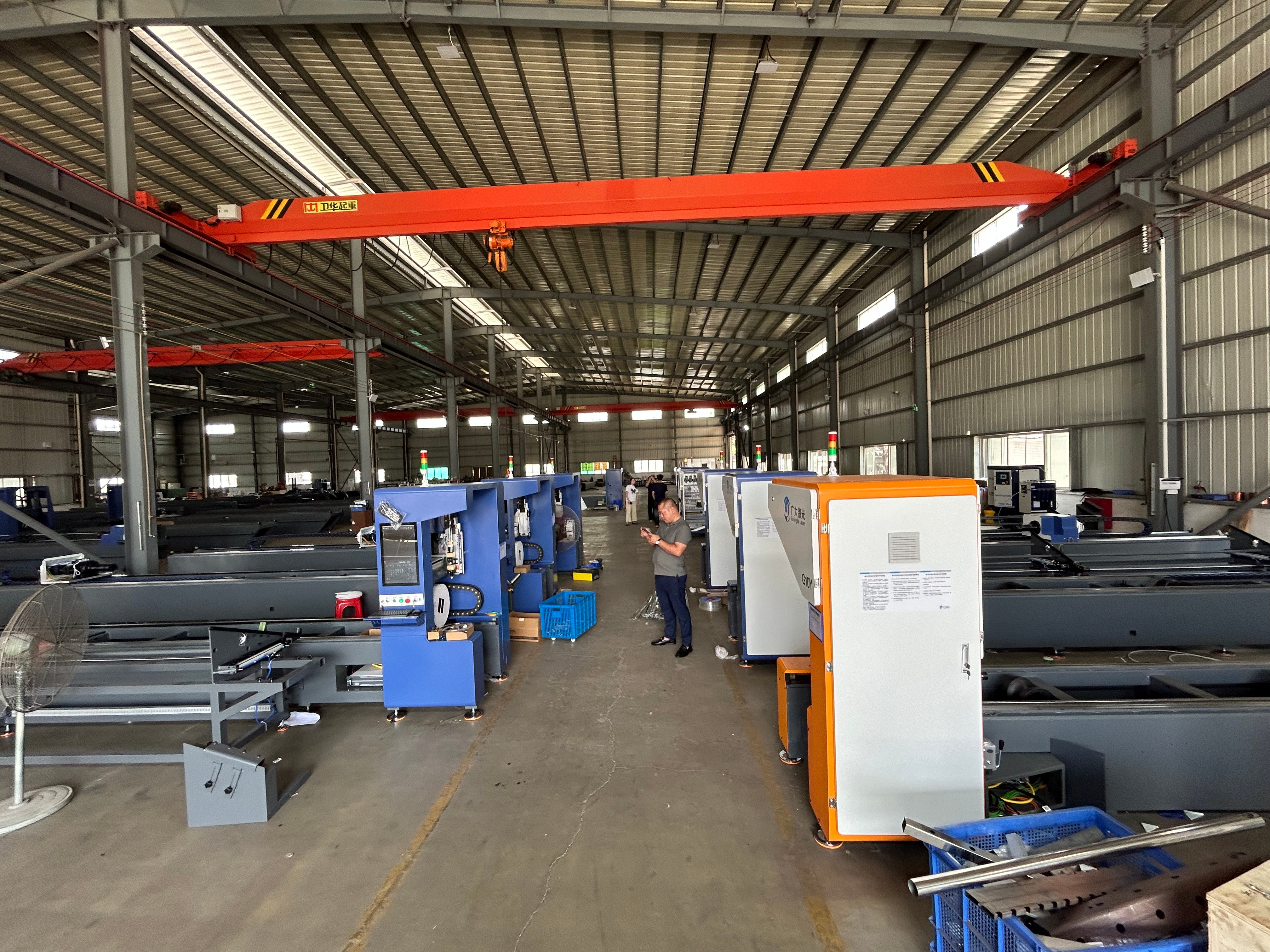 Overview of an industrial steel cutting machine at work.