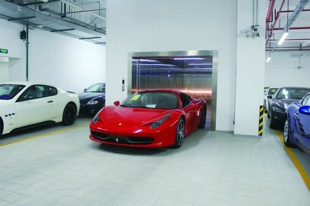 Automobile elevator in modern residential garage Automobile elevator in modern residential garage