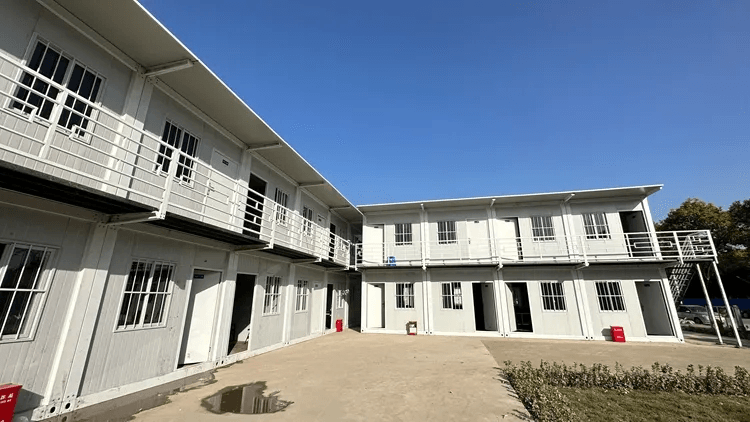Modern construction dorm building with stacked container units.