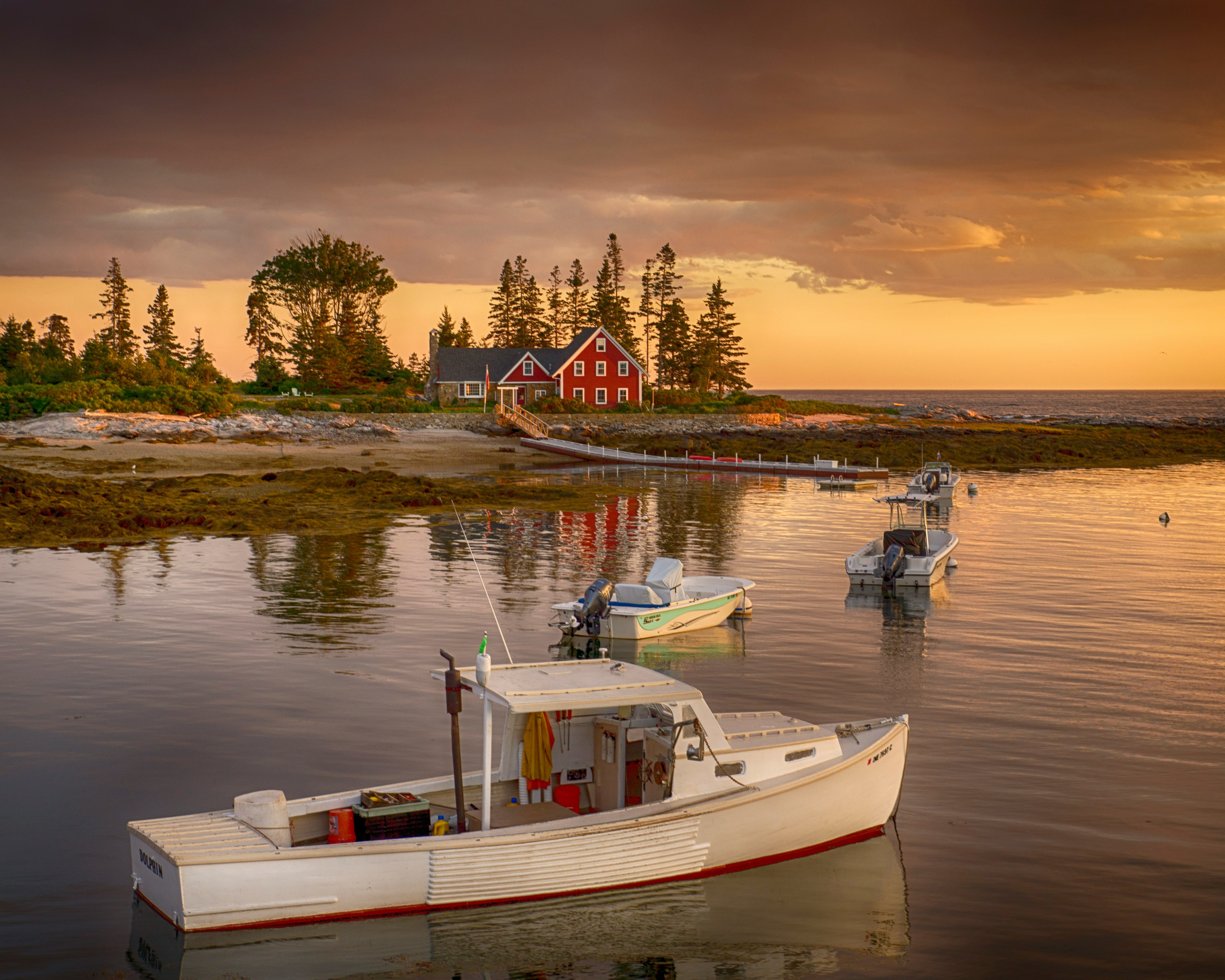 Small catamaran fishing boats ready for adventure at sunset Small catamaran fishing boats ready for adventure at sunset