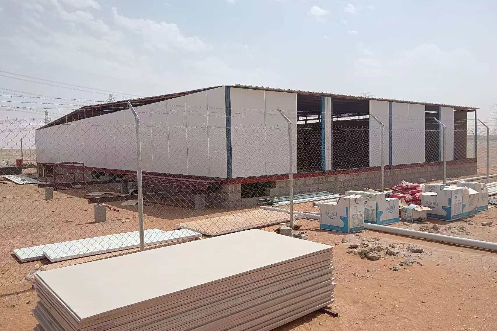 prefab bungalow being built with wooden framing