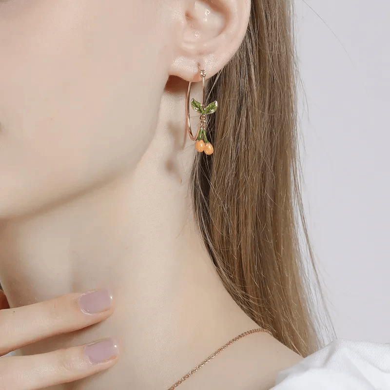 Playful collection of fruit jewelry featuring vibrant earrings and pendants. Playful collection of fruit jewelry featuring vibrant earrings and pendants.