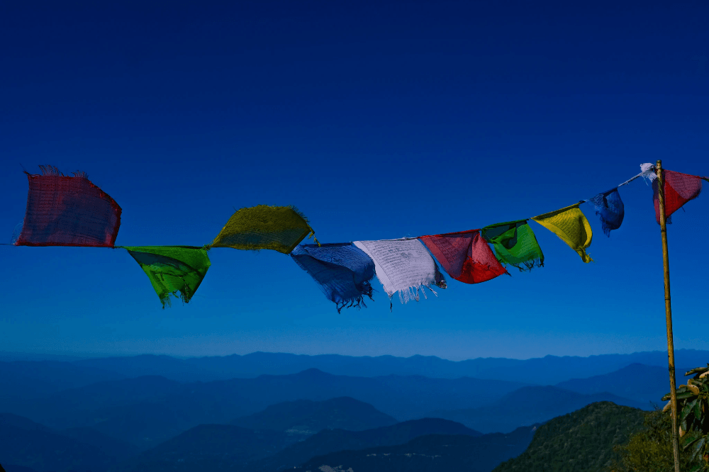 buddhist prayer flags meaning in colorful horizontal arrangement