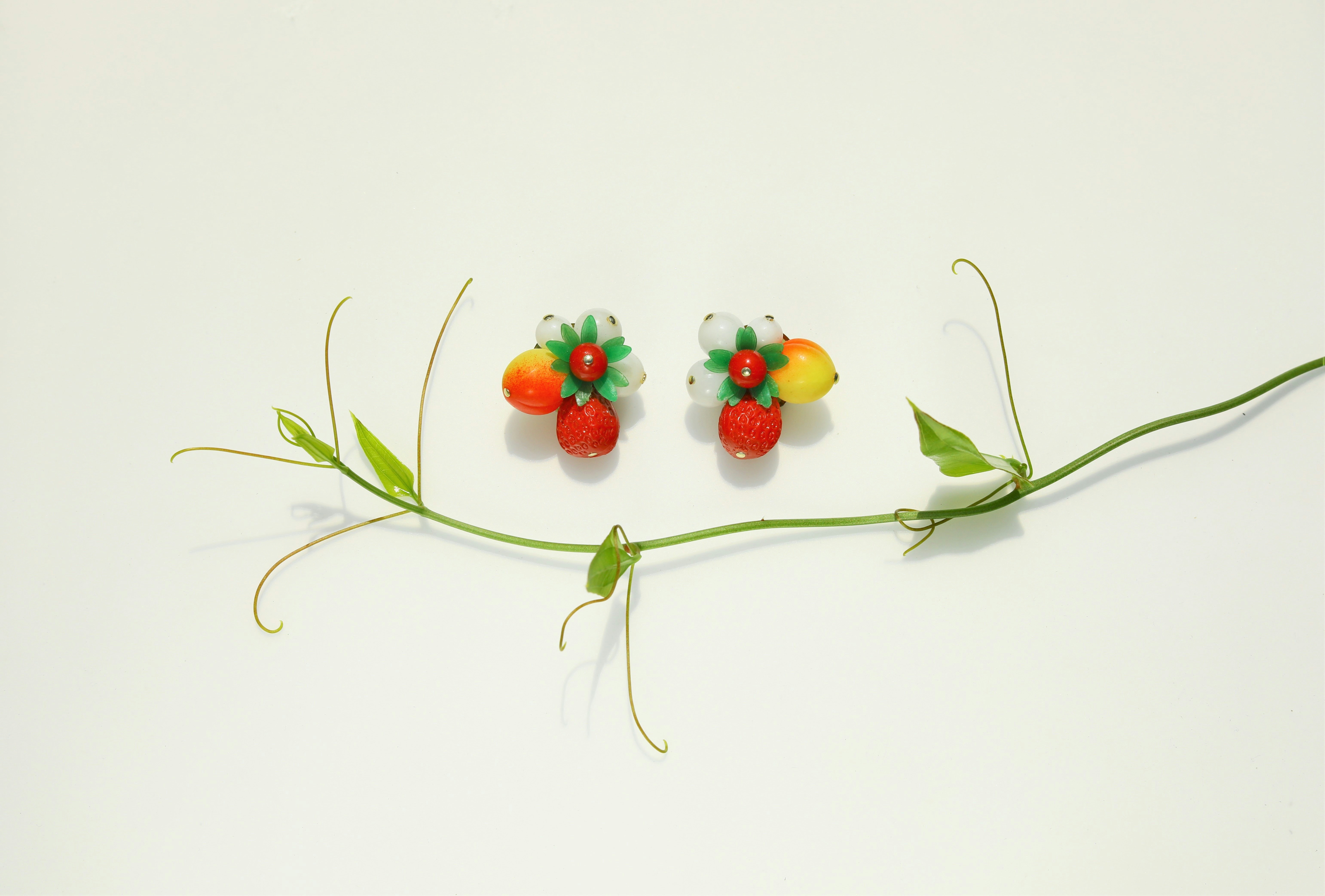 Fruit jewellery showcasing colorful pendant necklaces and playful earrings. Fruit jewellery showcasing colorful pendant necklaces and playful earrings.