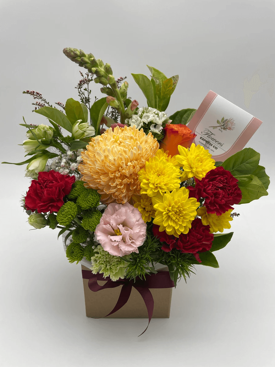 get well soon flowers combined with delicious treats in a thoughtful gift